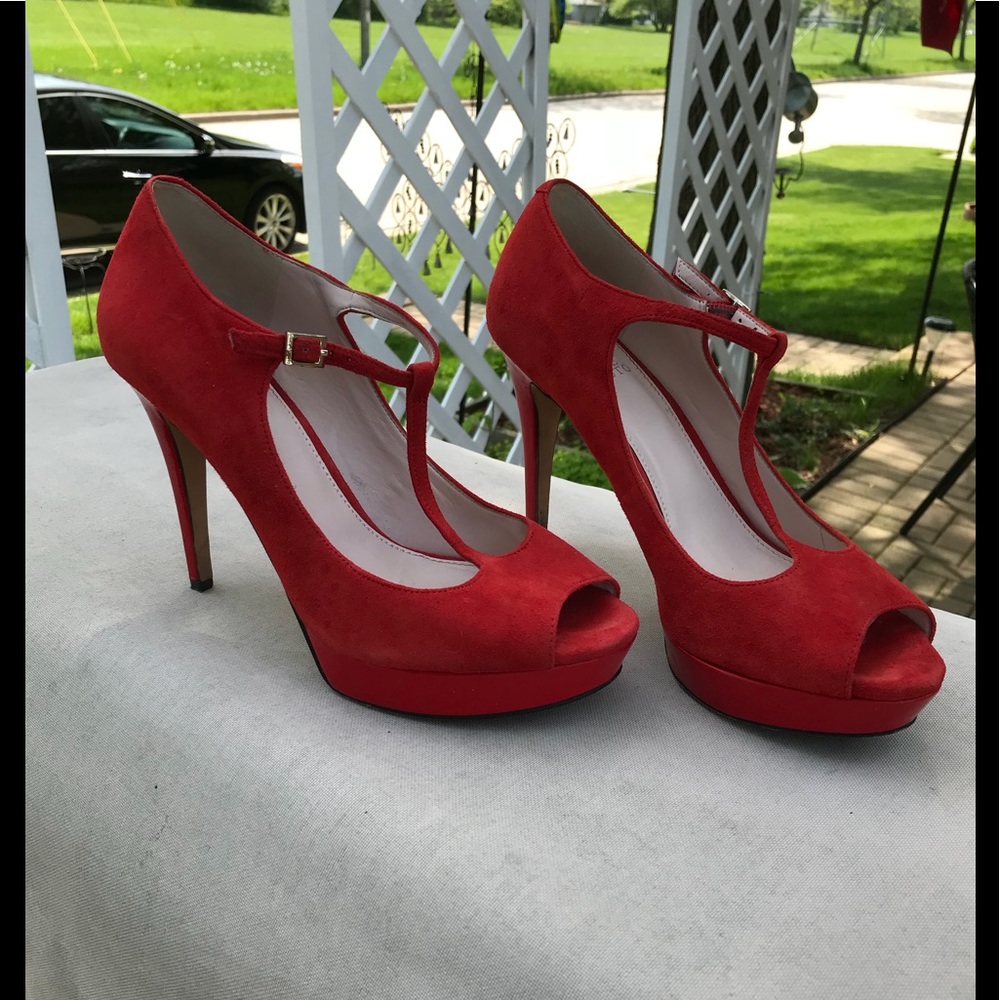 Vince Camuto red suede heels.